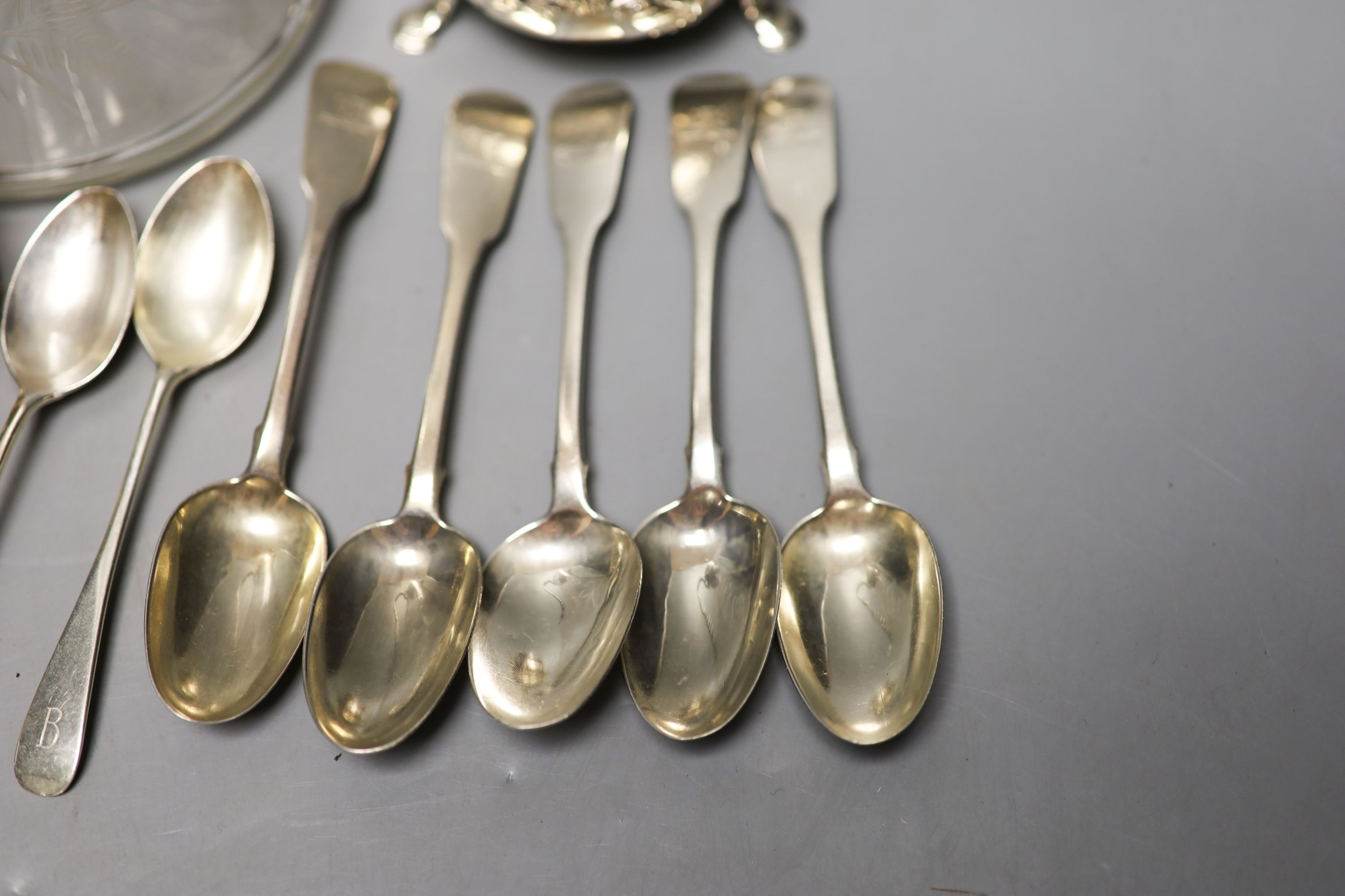 Five 19th century Irish silver fiddle pattern teaspoons, by Isaacs, two similar Scottish teaspoons, a pair if silver napkin rings, a Victorian silver bun salt and a silver plate mounted glass claret jug.